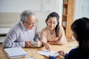 Senior Couple Filling Sale Deed Form